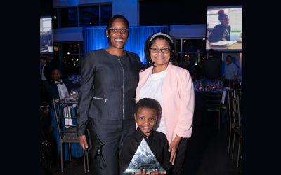 ILA awardee with principal and parent.