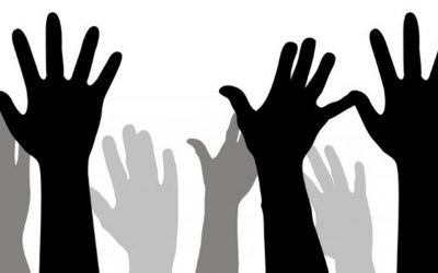Image shows silhouette of hands raised. 