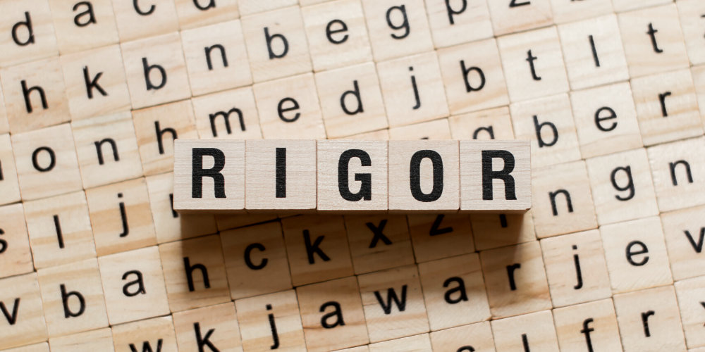 RIGOR spelled out in wooden letter blocks. 